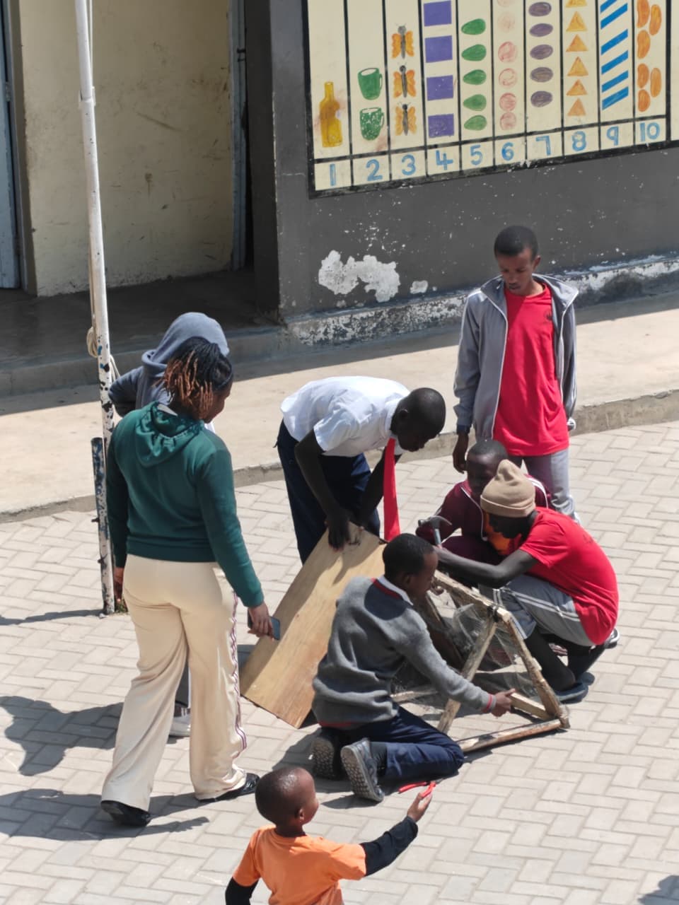 Junior secondary learners building a project frame together